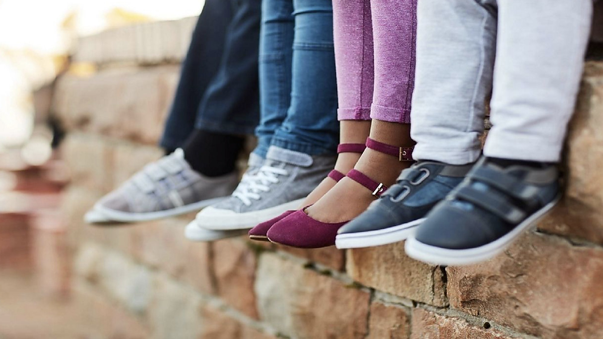 Children's feet in colorful new shoes